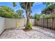 The backyard features a brick patio area with shade trees and a swing, creating a relaxing retreat at 101 E Lauren Ct, Fern Park, FL 32730