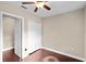 This bedroom features a ceiling fan, closet, and neutral paint, offering a blank canvas for personalization at 101 E Lauren Ct, Fern Park, FL 32730