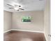 Bedroom with hardwood flooring, neutral wall paint, a window, and ceiling fan at 101 E Lauren Ct, Fern Park, FL 32730