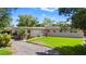 Charming single-story home featuring a well-manicured lawn, mature landscaping, and a welcoming entrance at 101 E Lauren Ct, Fern Park, FL 32730