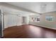 Spacious living room with hardwood flooring, bright windows, and easy access to other rooms at 101 E Lauren Ct, Fern Park, FL 32730