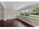 Bright living room featuring hardwood floors, a door, and many windows offering natural light and pleasant views at 101 E Lauren Ct, Fern Park, FL 32730