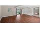 Spacious living room with hardwood flooring, a window, sliding glass doors and access to the outside at 101 E Lauren Ct, Fern Park, FL 32730