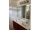 Bathroom featuring a double sink vanity with a large mirror and shower at 10128 Hartford Maroon Rd, Orlando, FL 32827