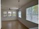Dining room featuring natural light, tile flooring and a decorative chandelier at 10128 Hartford Maroon Rd, Orlando, FL 32827