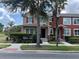 Charming two-story townhome with well-maintained landscaping and inviting curb appeal at 10128 Hartford Maroon Rd, Orlando, FL 32827
