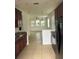 Open concept living area with tile flooring and abundant natural light at 10128 Hartford Maroon Rd, Orlando, FL 32827