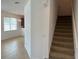 Inviting living room with a chandelier and large window for natural light at 10128 Hartford Maroon Rd, Orlando, FL 32827