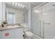 Bathroom with shower, vanity, and mirror, with an extinguisher inside cabinet at 1041 Park Ridge Cir, Kissimmee, FL 34746