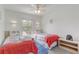 Bedroom with two twin beds, a window, and red and blue decor at 1041 Park Ridge Cir, Kissimmee, FL 34746