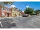 Charming townhome with easy access to parking, complemented by mature trees and tropical landscaping at 1041 Park Ridge Cir, Kissimmee, FL 34746