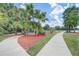 Community gazebo with seating surrounded by palm trees and walking paths, perfect for gatherings at 1041 Park Ridge Cir, Kissimmee, FL 34746