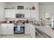 Bright kitchen equipped with stainless steel appliances, ample cabinet space, and modern finishes at 1041 Park Ridge Cir, Kissimmee, FL 34746