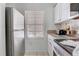 Well-lit kitchen with stainless steel appliances, ample counter space, and functional layout at 1041 Park Ridge Cir, Kissimmee, FL 34746
