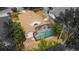 An aerial image showcases a home featuring a screened pool and landscaped backyard within a residential neighborhood at 11113 Sylvan Pond Cir, Orlando, FL 32825