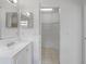 Bathroom with a vanity, mirror, and walk-in closet at 11113 Sylvan Pond Cir, Orlando, FL 32825