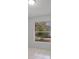 Sunlit bedroom with large window and neutral tile flooring at 11113 Sylvan Pond Cir, Orlando, FL 32825