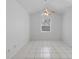 This bedroom features neutral paint, updated lighting, tile flooring and a window at 11113 Sylvan Pond Cir, Orlando, FL 32825