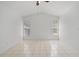 Large bedroom featuring tiled floors, a ceiling fan, and two windows at 11113 Sylvan Pond Cir, Orlando, FL 32825