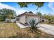 Well-maintained single-Gathering home with lush landscaping and a cozy front porch at 11113 Sylvan Pond Cir, Orlando, FL 32825