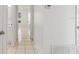 Hallway with tile floors leading to other rooms in the house at 11113 Sylvan Pond Cir, Orlando, FL 32825