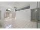 Spacious living room featuring high ceilings, tile flooring and backyard access at 11113 Sylvan Pond Cir, Orlando, FL 32825
