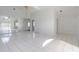 Bright, airy living room with tile floors and sliding glass doors to outdoor pool area at 11113 Sylvan Pond Cir, Orlando, FL 32825