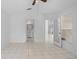 Main bedroom boasting tiled floors, a ceiling fan, and access to an en-suite bathroom at 11113 Sylvan Pond Cir, Orlando, FL 32825