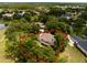 Aerial view showing the home's setting, mature trees, and surrounding neighborhood from an elevated perspective at 11335 Winston Willow Ct, Windermere, FL 34786