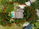 Aerial view of the property highlighting the home's layout, pool, green space, and surrounding landscape at 11335 Winston Willow Ct, Windermere, FL 34786