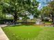 Spacious backyard featuring a putting green, playground, and cozy fire pit area, perfect for Gathering fun at 11335 Winston Willow Ct, Windermere, FL 34786