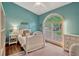 Serene bedroom with aqua walls, hardwood floors, and a large window with exterior view at 11335 Winston Willow Ct, Windermere, FL 34786