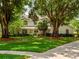 Charming two-story home with lush landscaping and mature trees at 11335 Winston Willow Ct, Windermere, FL 34786