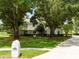Two-story home with a well manicured lawn and a basketball hoop at 11335 Winston Willow Ct, Windermere, FL 34786