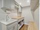 Efficient laundry room with a sink, counter space, cabinets, and wood accents for added warmth at 11335 Winston Willow Ct, Windermere, FL 34786
