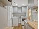 Well-organized laundry room featuring modern appliances, storage cabinets, and wood countertops at 11335 Winston Willow Ct, Windermere, FL 34786