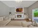 Inviting living room with fireplace and modern design elements for a comfortable living space at 11335 Winston Willow Ct, Windermere, FL 34786