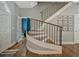 Elegant staircase with wood treads and black iron railing at 11335 Winston Willow Ct, Windermere, FL 34786