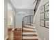 Elegant staircase with curved railing and hardwood floors at 11335 Winston Willow Ct, Windermere, FL 34786