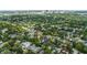 An aerial view showcasing the property with pool, lush surroundings and the city skyline at 1207 W New Hampshire St, Orlando, FL 32804