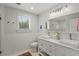 Bright bathroom with double vanity, sleek fixtures, and subway tile at 1207 W New Hampshire St, Orlando, FL 32804