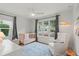 Cozy Bedroom with a crib, chair, and ample natural light at 1207 W New Hampshire St, Orlando, FL 32804