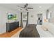 Comfortable bedroom with a ceiling fan, television, a view to the closet, and a relaxing ambiance at 1207 W New Hampshire St, Orlando, FL 32804