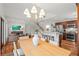 Open-concept living space featuring dining area, modern lighting, and seamless transition to the kitchen and living room at 1207 W New Hampshire St, Orlando, FL 32804