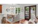 Dining room with hardwood floors and a door to the patio at 1207 W New Hampshire St, Orlando, FL 32804