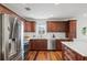 Well-equipped kitchen featuring stainless steel appliances and dark wood cabinets at 1207 W New Hampshire St, Orlando, FL 32804