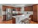 Spacious kitchen with stainless steel appliances, marble countertops, and a breakfast bar at 1207 W New Hampshire St, Orlando, FL 32804