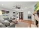 Comfortable living room featuring a couch, fireplace, and hardwood floors at 1207 W New Hampshire St, Orlando, FL 32804