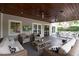 Relaxing covered outdoor deck with a view of the pool at 1207 W New Hampshire St, Orlando, FL 32804