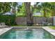 Poolside fire pit with chairs and lounge chairs at 1207 W New Hampshire St, Orlando, FL 32804
